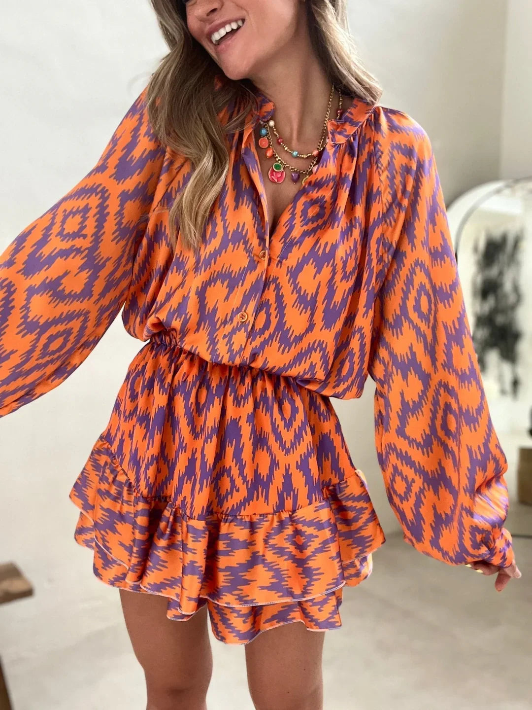 Eira Dress | Long Sleeve Ruffled Hem Mini Dress
